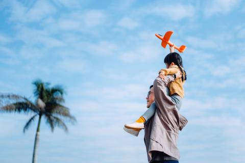 asian-father-carrying-his-little-daughter-on-shoulders